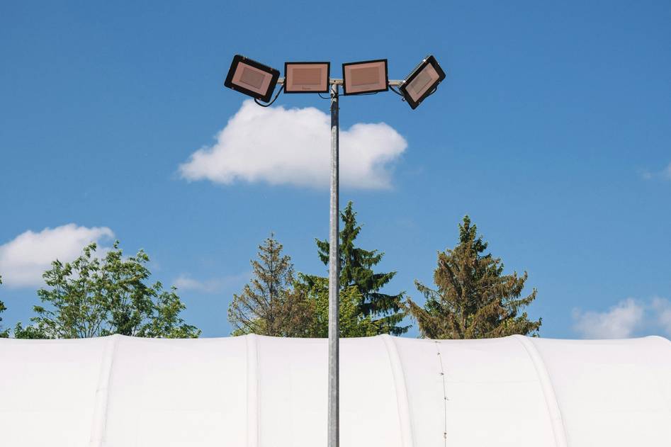 Blog author reviewing outdoor security floodlights in backyard setting