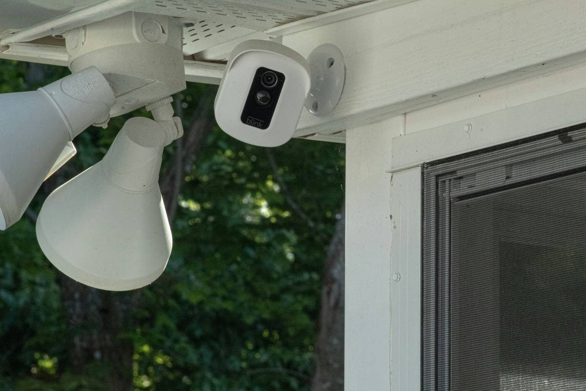 Close-up of correctly mounted outdoor security light showing sensor angle and height for how to fit outdoor security lights