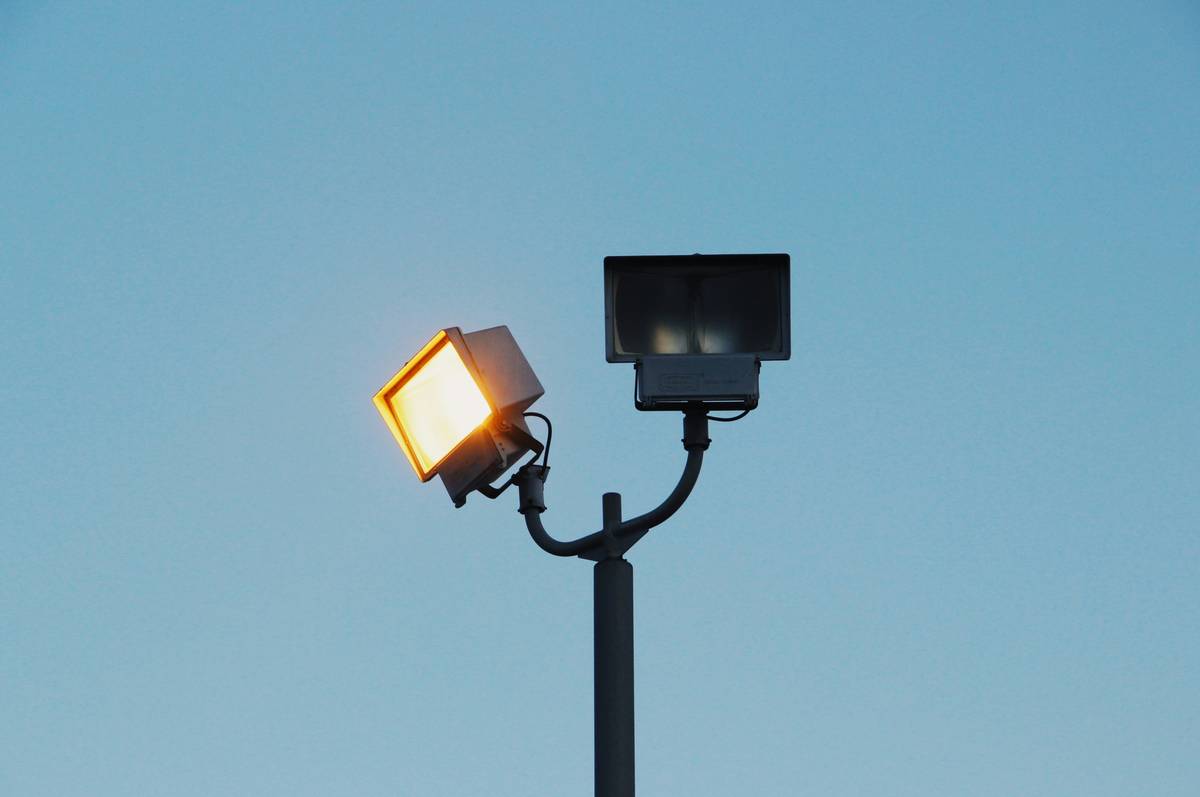 Smart outdoor security led lights integrated with home security app showing real-time alert