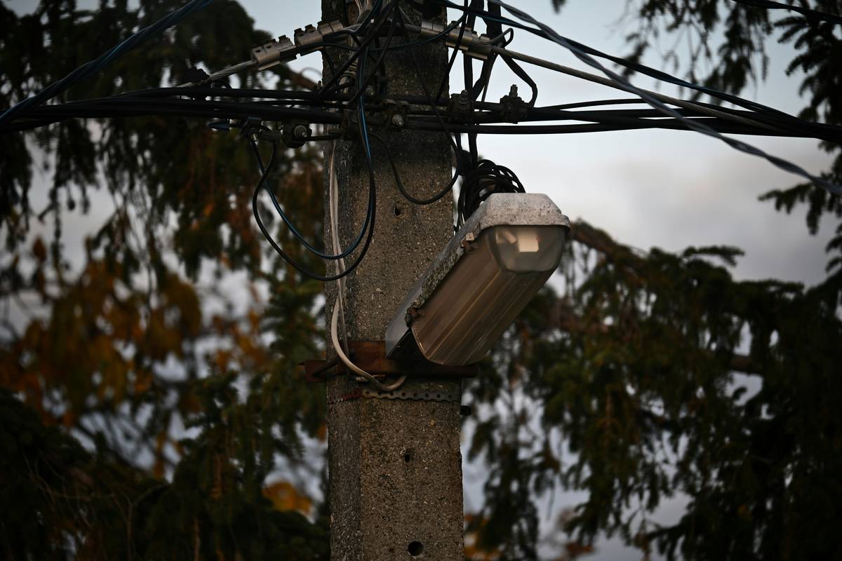 Close-up of professionally labeled wires during how to wire outside security lights installation